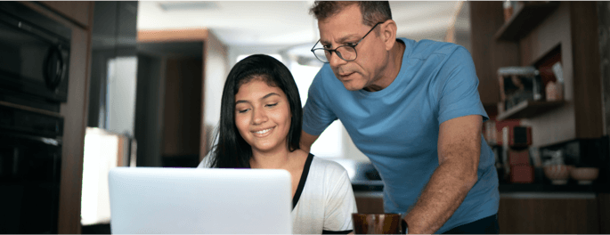 father and daughter over computer